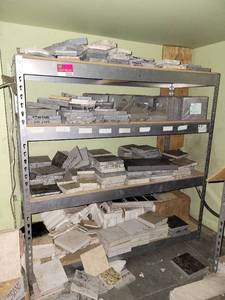 lot 22035 image: Gray 4-Tier Industrial Shelf W an Assortment of Samples
