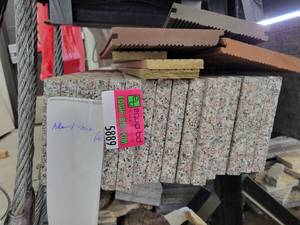 lot 5889 image: Shelf of 16 Almond Mauve Polished Granite Back Splashes