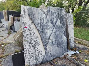 lot 7000 image: Rack of Assorted Remnants - St. Moritz Limestone, Ubatuba Granite, and Sumremel White Granite