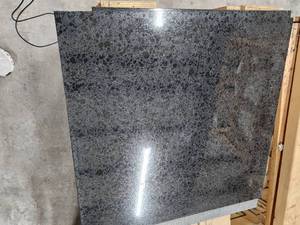 lot 5710 image: Crate of Black Absolute 18 x 18 Polished Granite Tiles