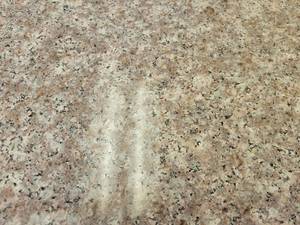 lot 9377 image: Crate of Almond Mauve Polished Granite Pre Fabricated Countertops, 12