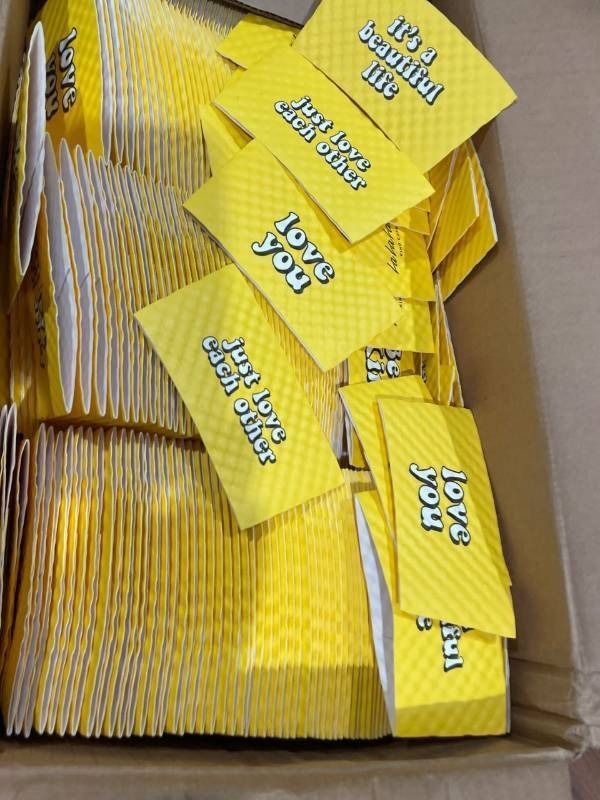 lot 21678 image: Hot Cup Sleeve Protectors 12 to 20 ounce yellow Java Jackets 1300case Uplifting Messages (Retail $59.99)