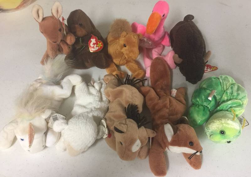lot 1107 image: TEN Original Ty Beanie Babies Squirmy Roam Pinky Niles Seaweed Sly Pouch Derby Fleece Mystic