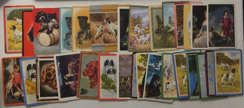 lot 1053 image: 34 Original 1940s and 1950s Swap & Playing Cards with Various Images of Dogs