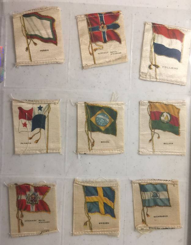 lot 1055 image: NINE True Antique Original 1900-1910s Tobacco Country Flag Silks including Holland, Sweden, Brazil, and More