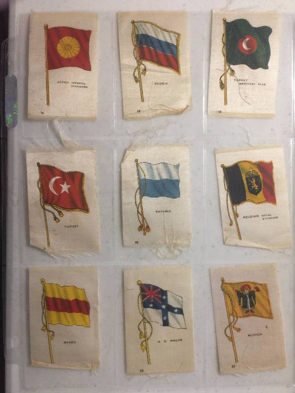 lot 1056 image: NINE Original 1900-1910s Tobacco Country Flag Silks including Japan, Russia, Turkey, Munich, and more