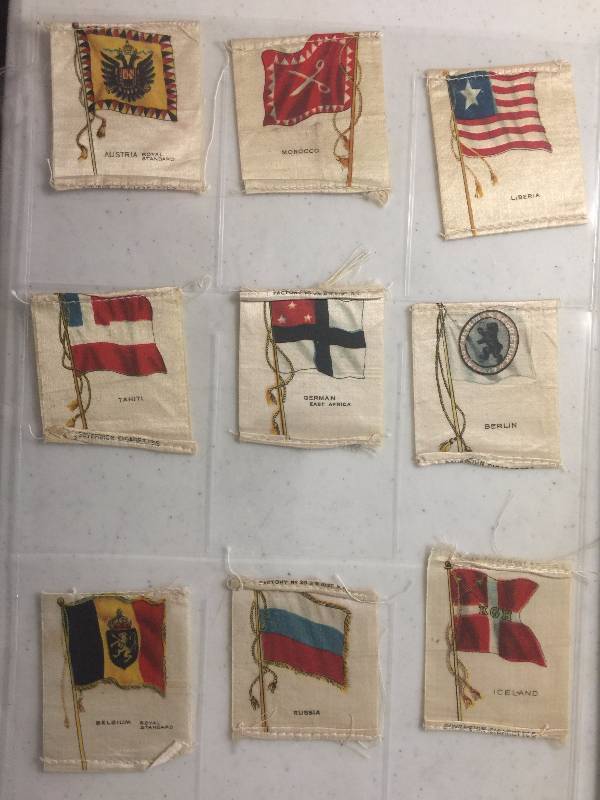 lot 1064 image: NINE Original 1900-1910s Tobacco Country Flag Silks including Tahiti, Ireland, Liberia,  Morocco, German, Iceland, and more