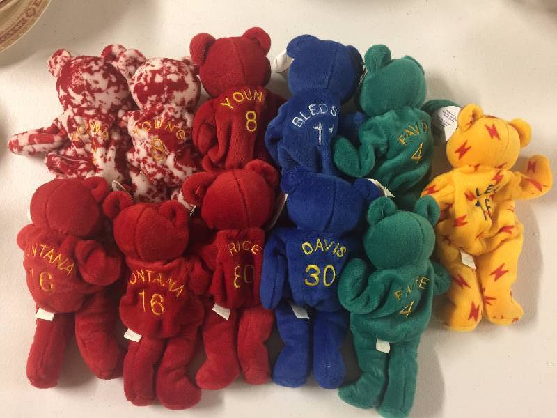 lot 1187 image: ELEVEN Bamm Beanos Style Sports Teddy Bears Including Steve Young x3, Joe Montana x2, Jerry Rice, Brett Favre, Davis, Bledose, Leaf