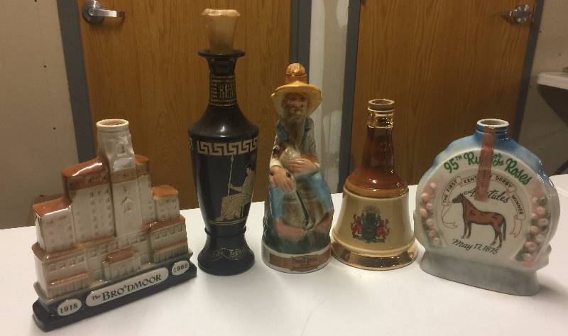 lot 1210 image: FIVE Vintage Decanters Horse racing, Egyptian, Whiskey, Bell, Hotel (Empty)