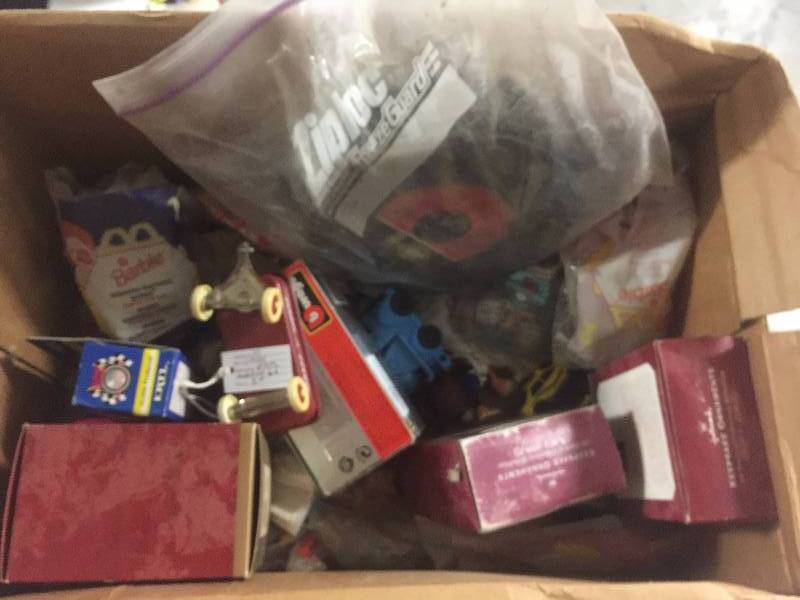 lot 1214 image: Box of Smalls Including McDonalds Toys Barbies, Hot Wheels, Hallmark Ornaments, 45 Records Much More