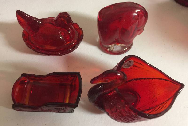 lot 1245 image: Four Small Ruby Red Glass Pieces Animals & Sled Liftons Chicken, Elephant, Swan, Sled
