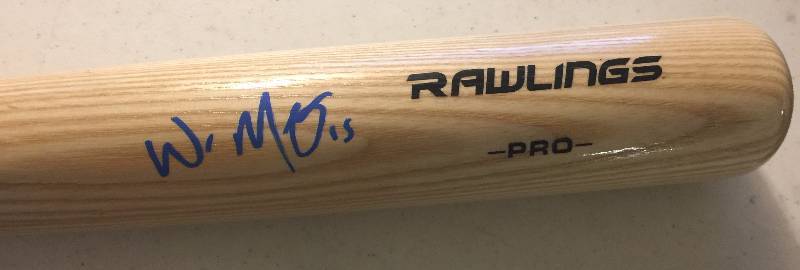 lot 801 image: Signed Full Sized Whit Merrifield Rawlings Baseball Bat with Blue Ink Autograph