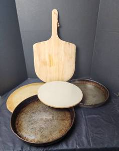 lot 227 image: Pampered Chef Pizza Stone, Pizza Paddle, and (2) Deep Dish Pizza Pans