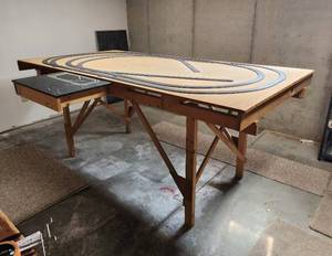 lot 517 image: Model Train Table - Needs Taken Apart to Remove - Located in Basement