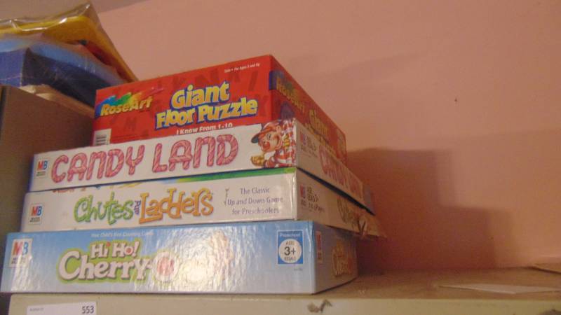 lot 553 image: tub full of Wooden puzzles - board games