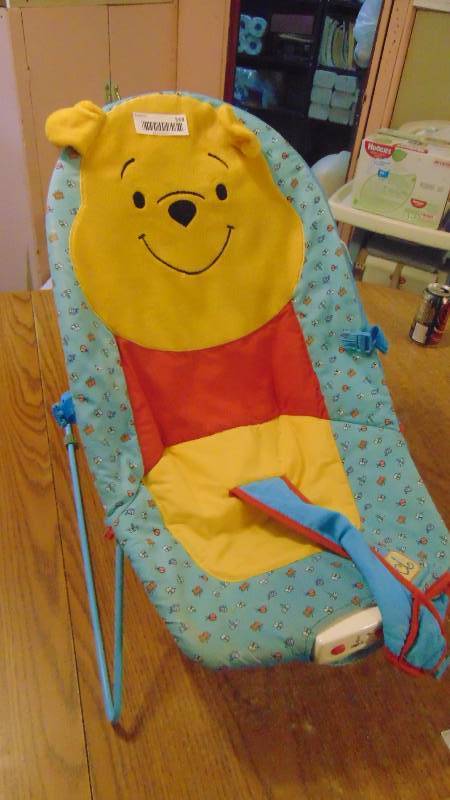 lot 568 image: Pooh baby bouncer