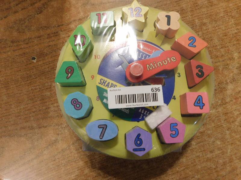 lot 634 image: Melissa & Doug learning clock - wood