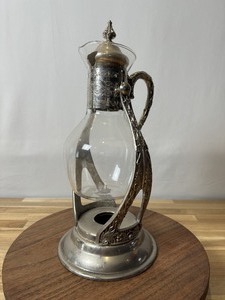 lot 19948 image: Antique Silver Tea decanter with Tilting Stand and Heater Base