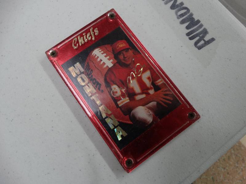 lot 1042 image: Joe Montana Chiefs football card in plastic.