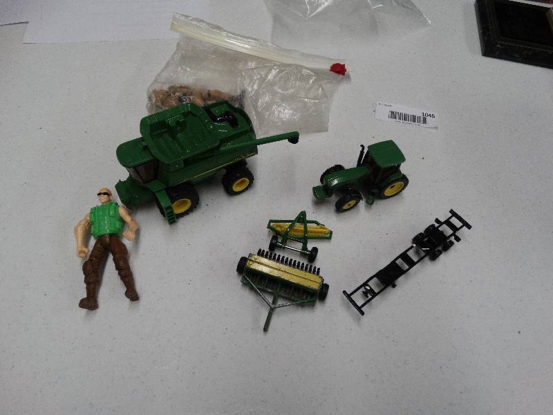 lot 1045 image: Lot of vintage John Deere toys.
