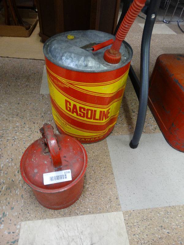 lot 1058 image: 5 gallon metal gas can & small solvent container.