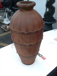 Very nice Decour vessel 26 inches tall made of wood but looks like metal very nice