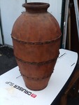 Very nice Decour vessel 36 inches tall made of wood but looks like metal very nice