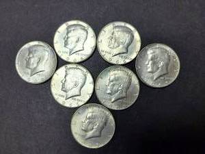 lot 73 image: LOT OF (7) 40% SILVER KENNEDY HALF DOLLARS