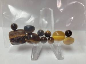 lot 193 image: 38.05 Carats of Loose Tigereye Gemstones