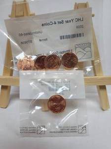 lot 422 image: 2009 LINCOLN HEAD CENT 4-COIN SET & (1) 2010 LINCOLN HEAD CENT