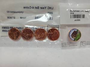 lot 425 image: 2009 4-COIN LINCOLN HEAD CENT SET & (1) 2009 COLORIZED LINCOLN HEAD CENT