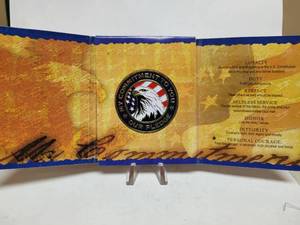 lot 575 image: NATIONAL GUARD MY COMMITMENT TO YOU COLORIZED COIN & BOOKLET