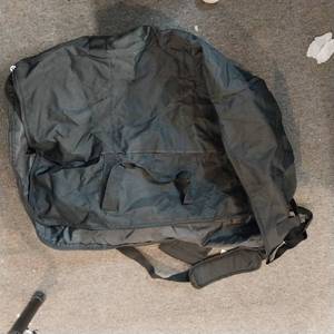 lot 13702 image: large black duffle bag eith Zipper handles and shoulder strap
