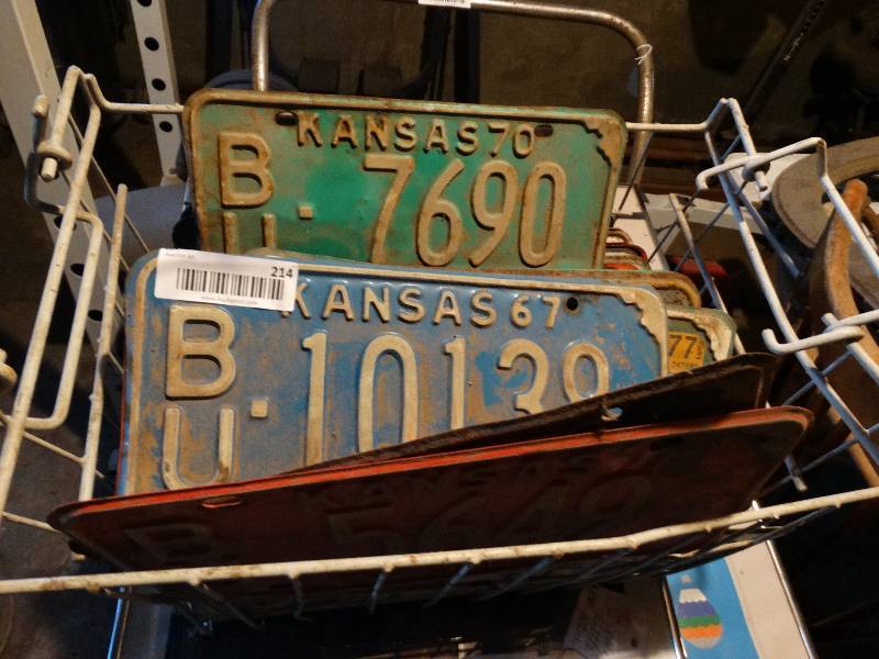 lot 214 image: Wire basket full of license plates