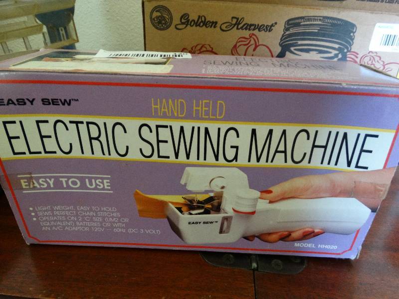 lot 120 image: Handheld electric sewing machine