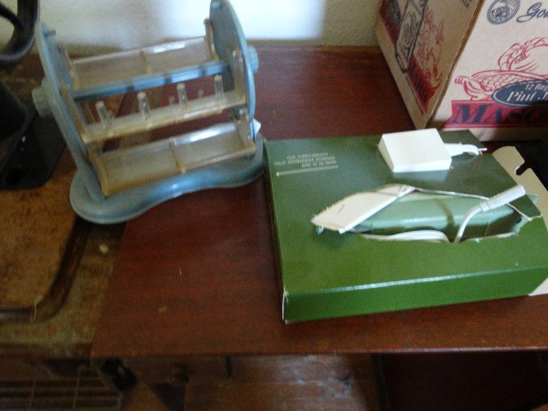 lot 123 image: Rotating display & Sears electric scissors.