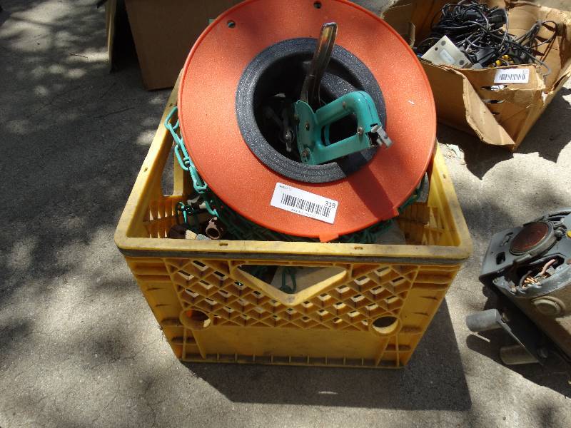 lot 319 image: Spool of chain, stapler, sprinklers.