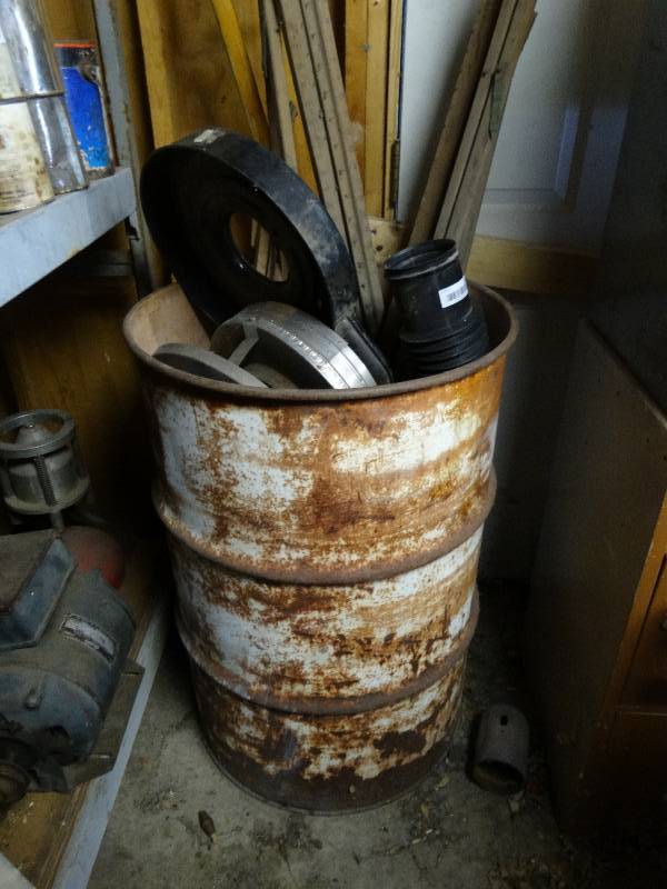 lot 379 image: Metal barrel of various items.