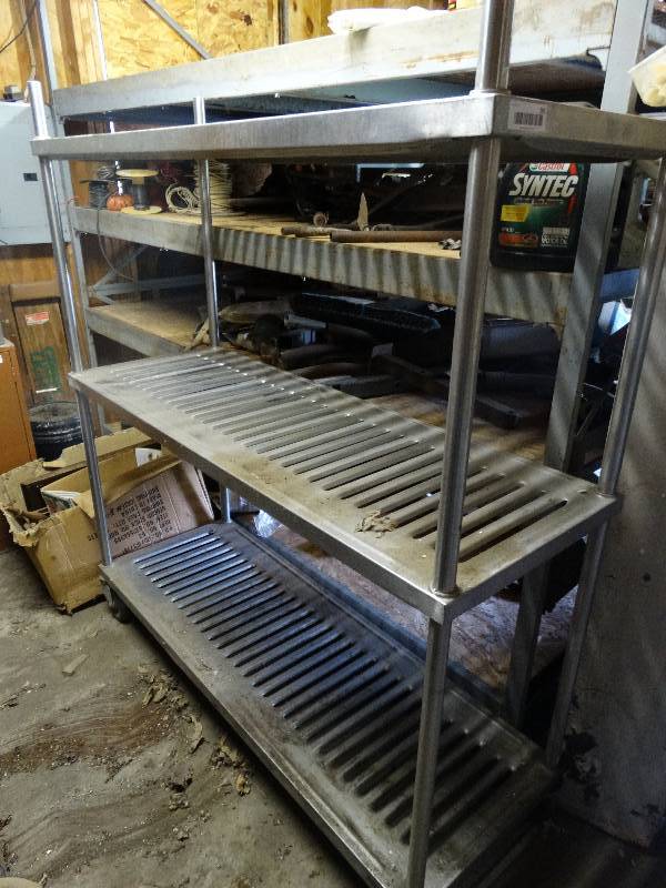 lot 391 image: Metal shelving on wheels.