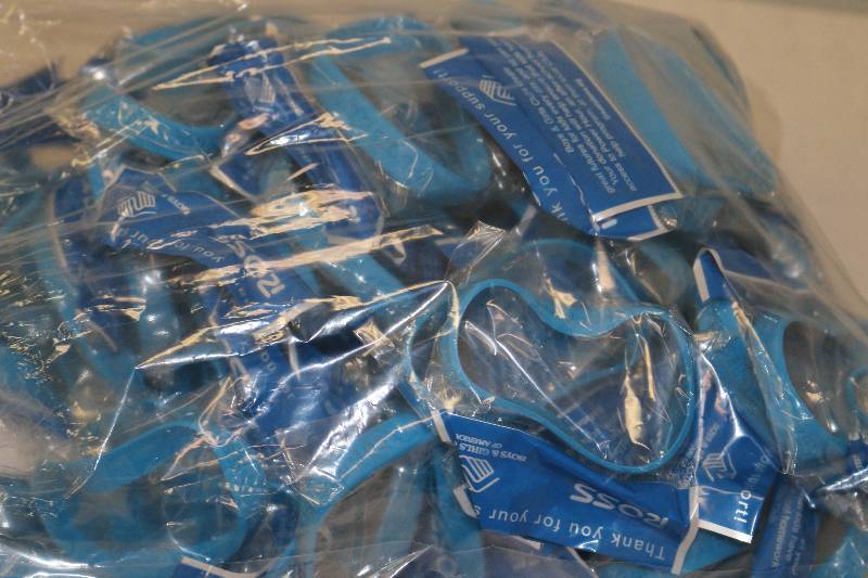 lot 6723 image: 90 Boys & Girls Club Blue Bracelets