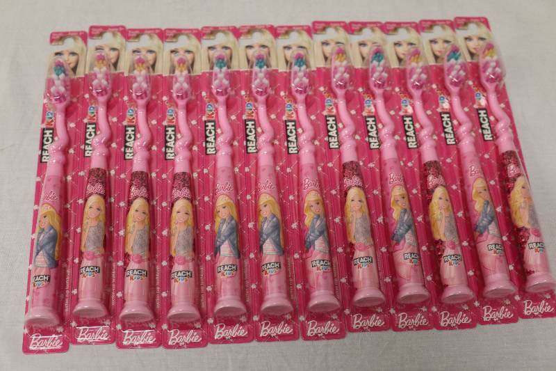 lot 6762 image: Barbie Reach Toothbrushes
