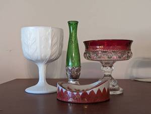 lot 566 image: Vintage Milk Glass Goblet, Avon Green Glass Bud Vase, Kings Crown Compote, and Charleton Dish.