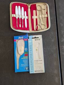 lot 584 image: (2) Thermometers, and Manicure Set.