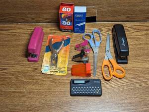 lot 629 image: Staplers, Staples, Scissors, Printer Ink, Staple Removers and Spell Checker.