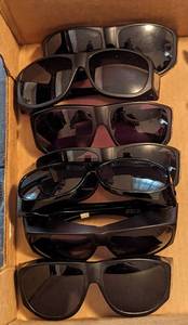 lot 699 image: (7) Solar Shield Sun Glasses.