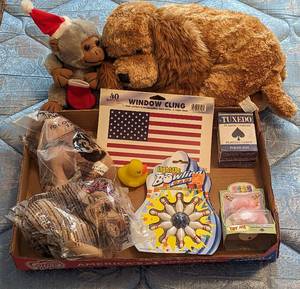 lot 702 image: Stuffed Animals, Playing Cards, Bowling Game, and American Flag Decal.