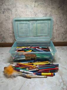 lot 760 image: Writing Utensils in Plastic Bin.