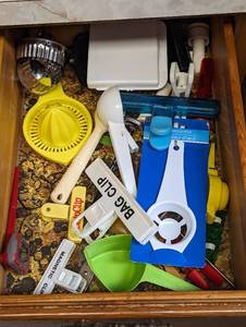 lot 816 image: Chip Clips, Orange Juicer, Seperator, and more.