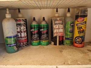 lot 1067 image: Fix-A-Flat, Tite Seal, Tire Sealant.