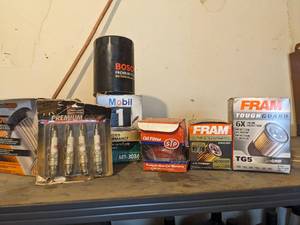 lot 1124 image: Oil Filters and Spark Plugs.